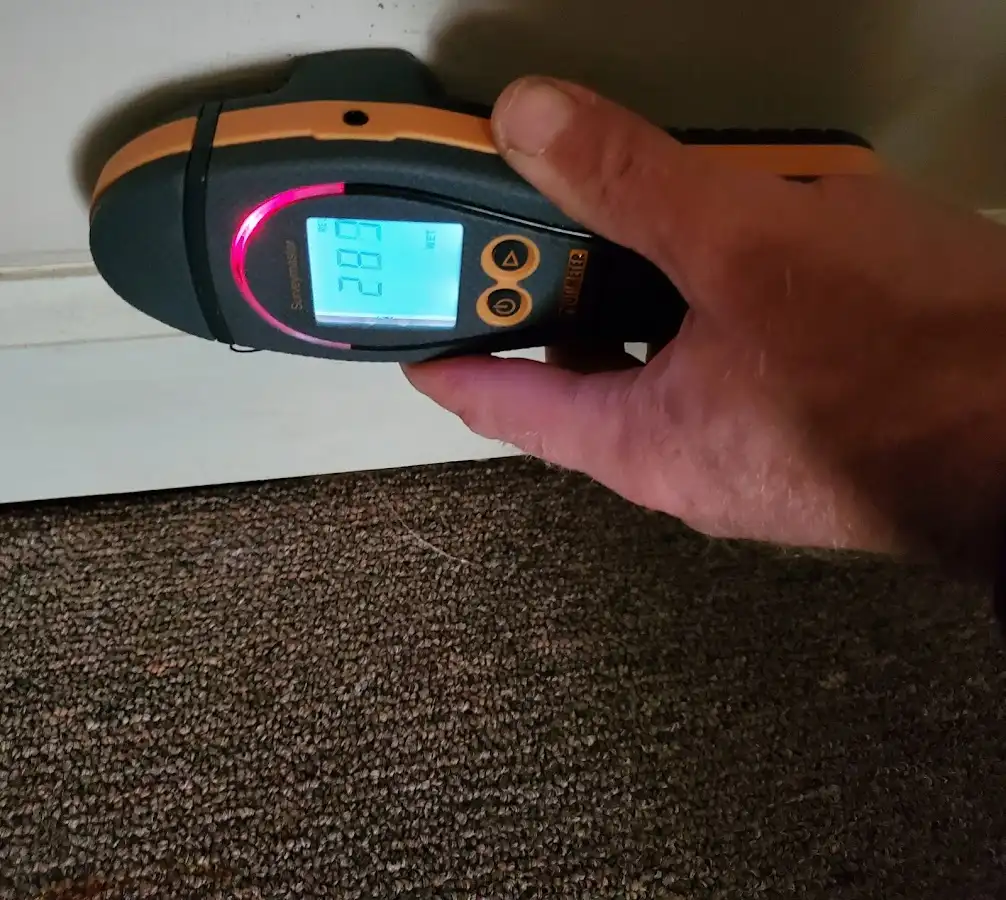 Moisture detection at baseboard during Sewage Cleanup & Sanitation in De Queen